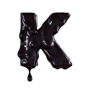 K organic letter. Black flowing paint on the symbol. oil mark. W